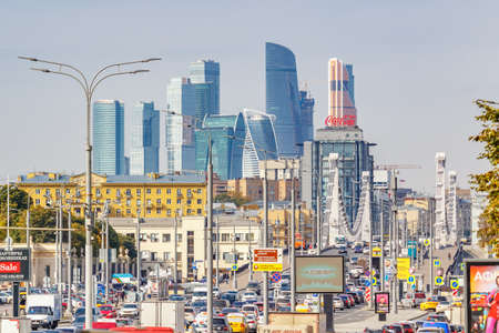 Moscow, Russia - October 03, 2019: View of buildings of Business center Moscow City against Krymsky Bridge above Moskva River in sunny autumn morning. Moscow landscape in sunlightのeditorial素材