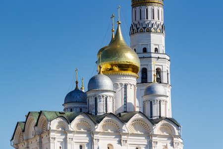Moscow, Russia - May 01, 2019: Domes and white walls of Cathedral of the Archangel on the territory of Moscow Kremlin in sunny spring morningのeditorial素材