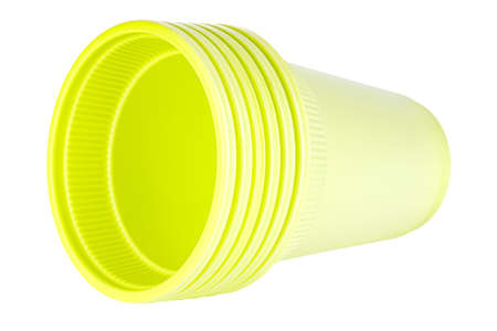 Lying set of six unused green disposable cups made of biodegradable materials isolated on white backgroundの写真素材