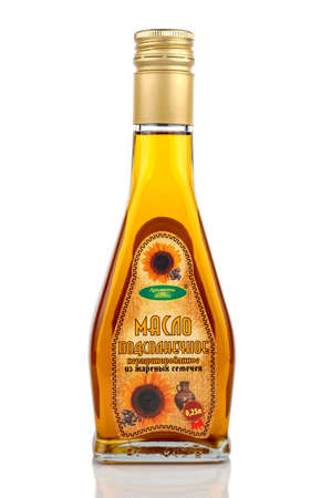 Moscow, Russia - February 09, 2020: Unrefined sunflower oil in pyramid transparent glass bottle isolated on white backgroundのeditorial素材