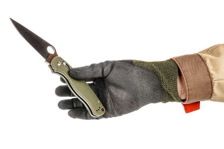 Male hand in black protective glove and brown uniform holding by fingers open pocket folding knife...