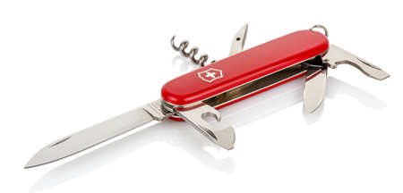 Moscow, Russia - May 15, 2020: Lying Victorinox red classic swiss pocket foldable knife with opened all tools isolated on white background with reflection on glossy surfaceのeditorial素材