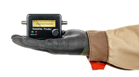 Satellite finder lies in palm of man hand in black protective glove and brown uniform isolated on...