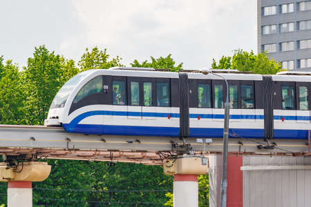 Moscow, Russia - May 12, 2019: Train of Moscow monorail transport system against green trees in sunny dayのeditorial素材
