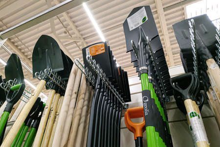 Moscow, Russia - August 17, 2019: Various shovels on the stand in a building materials store