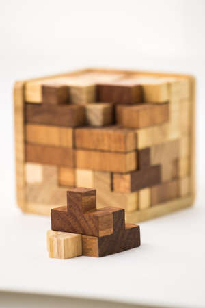 A cube built from wooden blocks. Puzzle.の写真素材