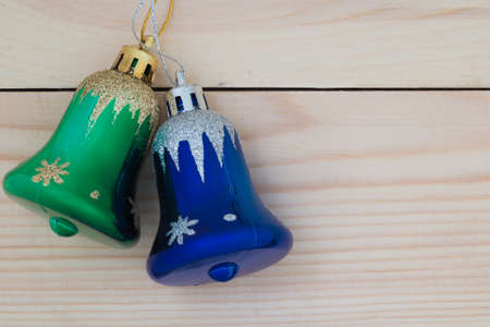 The Christmas bells on a wooden backgroundの写真素材