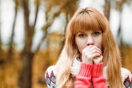 Beautiful young woman - a colorful autumn portraitの写真素材