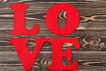 red word LOVE on wooden background for Valentine's dayの写真素材