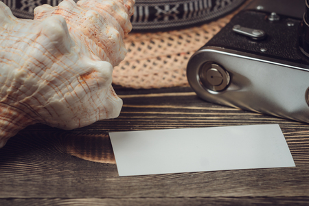 Travel and vacation photo frames and items on wooden table. Top viewの写真素材