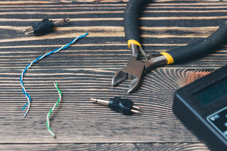 electric tools on a brown wooden backgroundの写真素材