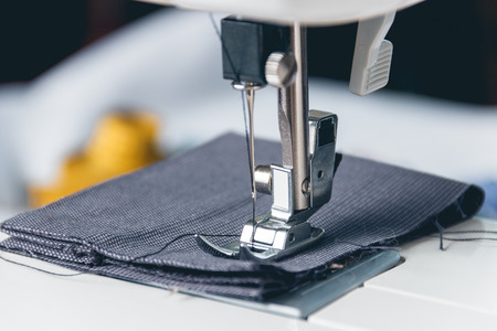 sewing machine and item of clothing. close up