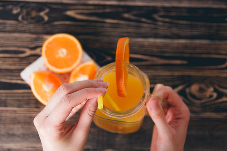 Orange, Orange Lobule, Jar of Juice on the Wooden Table. Healthy Lifestyle Conceptの写真素材