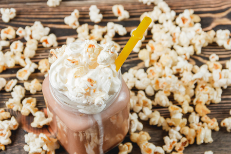 Fresh Popcorn Cocoa on Wodden Background Unhealthy Food Conceptの写真素材