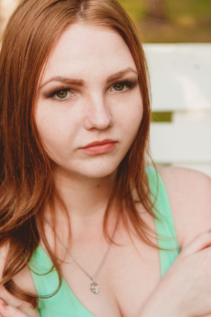 Beauty Girl Outdoors Enjoying Nature. Beautiful Teenage Model Girl with Long Hair, Free Happy Woman. Toned in warm colors. Beauty Conceptの写真素材