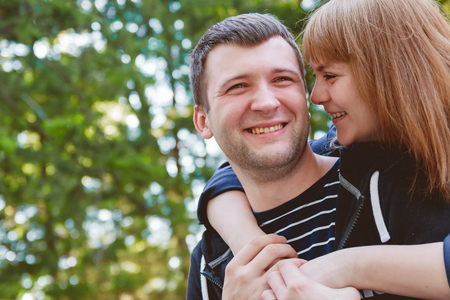 Cheerful Romantic Couple in Love in Park Huging Together Family Conceptの写真素材