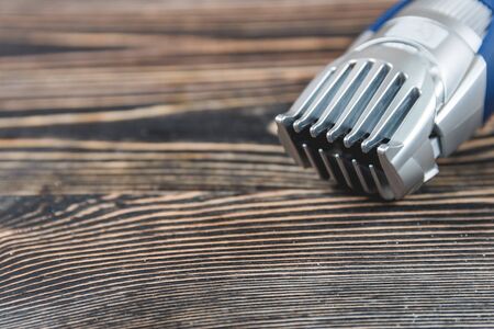 Electric Razor, Hair Trimmer on a Wooden Table, Care Conceptの写真素材