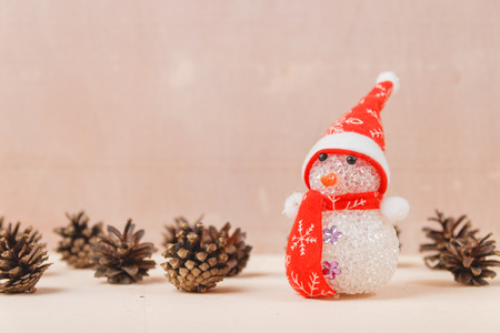 Snowman Toy on White Wooden Backdrop. Merry Christmas and Happy New Year Conceptの写真素材