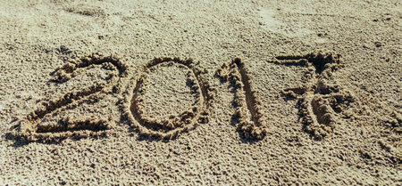 2017 inscription written on sandy beach. new year conceptの写真素材