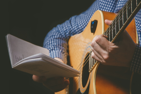 Close up of guitarist hand playing guitarの写真素材