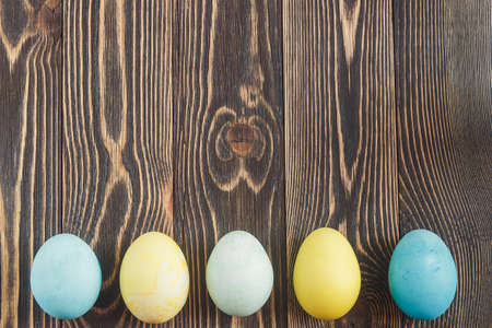 Easter eggs on wooden background with copyspace