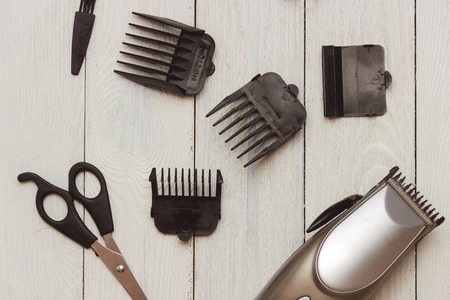 Stylish Professional Hair Clippers, accessories on wood backgroundの写真素材