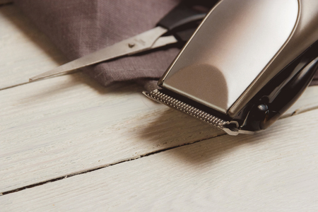 Stylish Professional Hair Clippers, accessories on wood background copy spaceの写真素材