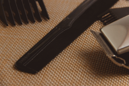 Stylish Professional Hair Clippers, accessories on brown backgroundの写真素材