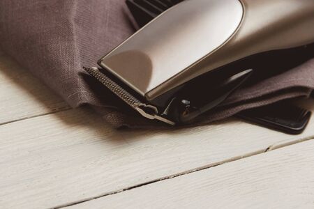 Stylish Professional Hair Clippers, accessories on wood background copy spaceの写真素材