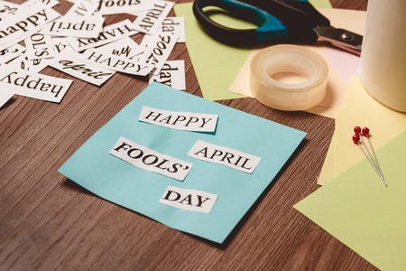 Happy April Fools Day phrase on wooden background