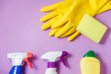 Cleaning Products. Home Cleaning Concept. Lilac Background. Place for Typography and Logo. Copy space. Flat Lay. Topの写真素材