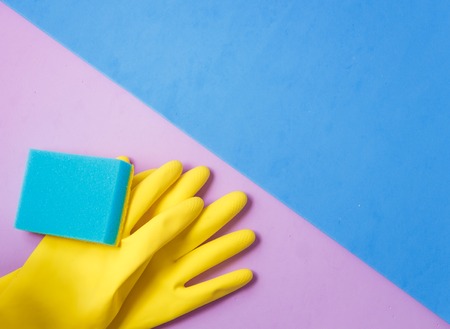 Cleaning products. Home cleaning concept. Blue and Lilac background. Gray tile floor. Place for...
