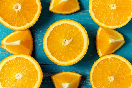 fresh oranges, top view. Healthy citrus fruits on blue wooden background, top view, copyspace.