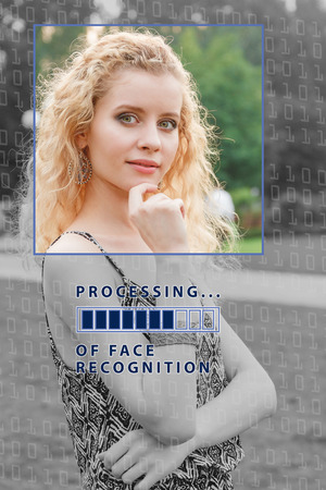 Biometric verification. young woman with status bar. The concept of a new technology of face recognition.の写真素材
