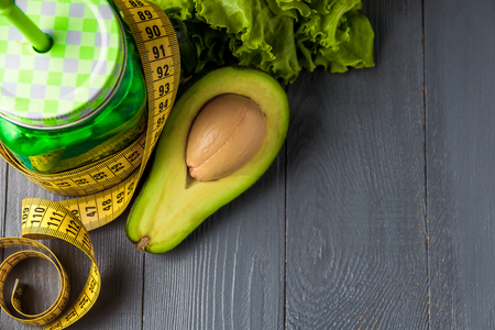 Glass of fresh vegetable juice on gray wooden background. Top view healthy concept with copyspace.の写真素材