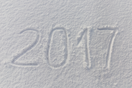 2017 numbers written on fresh snow fieldの写真素材