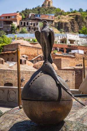 TBILISI, GEORGIA - July 16, 2014: Sculpture of Falcon and Pheasant. Historical Abanotubani district. Old Town of Tbilisiのeditorial素材