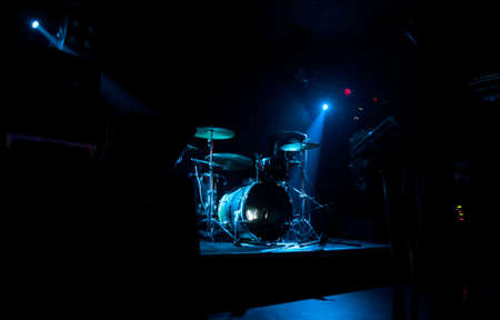 Dark and grainy image of a stage ready for a music band live performanceの写真素材