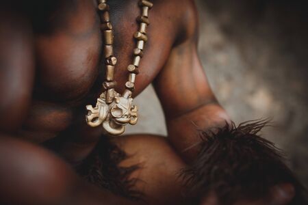 The bodyart man angry minotaur greek with axe in caveの写真素材