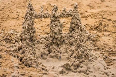 sand castle on the river bank on the beachの写真素材