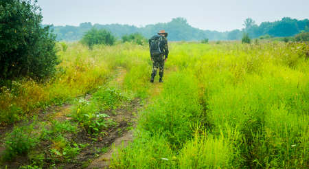 traveler, tourist walking on deserted road STALKERの写真素材