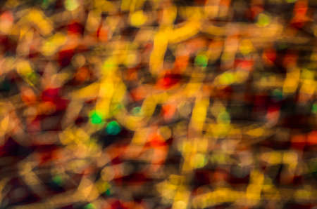 Colorful beautiful multi-colored Christmas lights on a black backgroundの写真素材