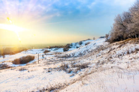 Winter dawn in the mountains on a sunny dayの写真素材