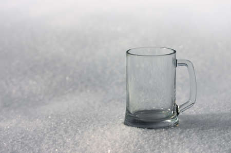 The large glass mug in the snow