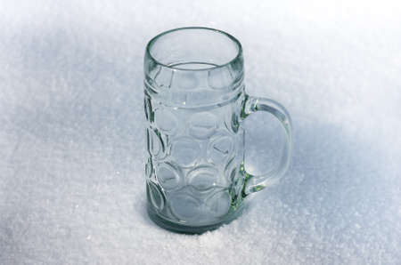 The large glass mug in the snow