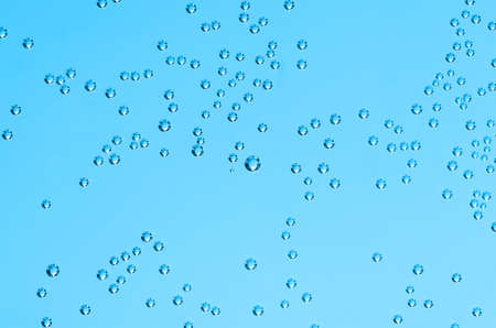 beautiful air bubbles on a blue background closeの写真素材