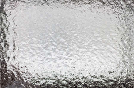 Abstract frosty icy pattern on a dark glass.