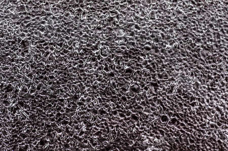 Abstract frosty icy pattern on a dark glass.の写真素材