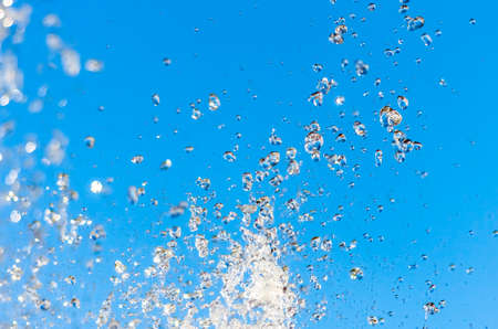 Water fountain on a background of blue skyの写真素材