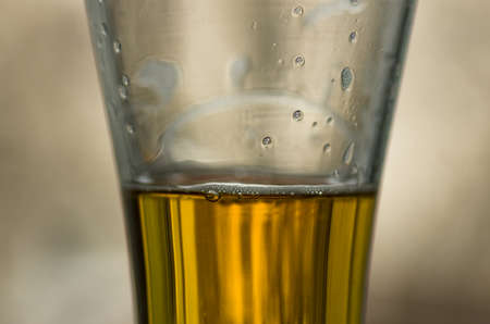 Light beer poured in a glass closeup